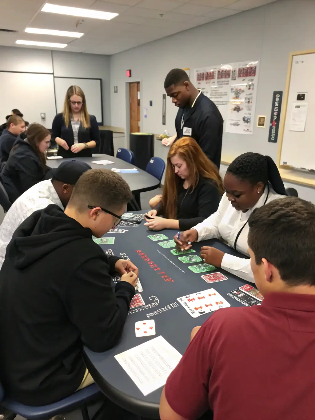 A group of people participating in a poker strategy workshop, focusing on the educational aspects of the game.